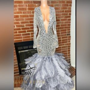 Silver long sleeved feathered mermaid dress prom dress. Size small